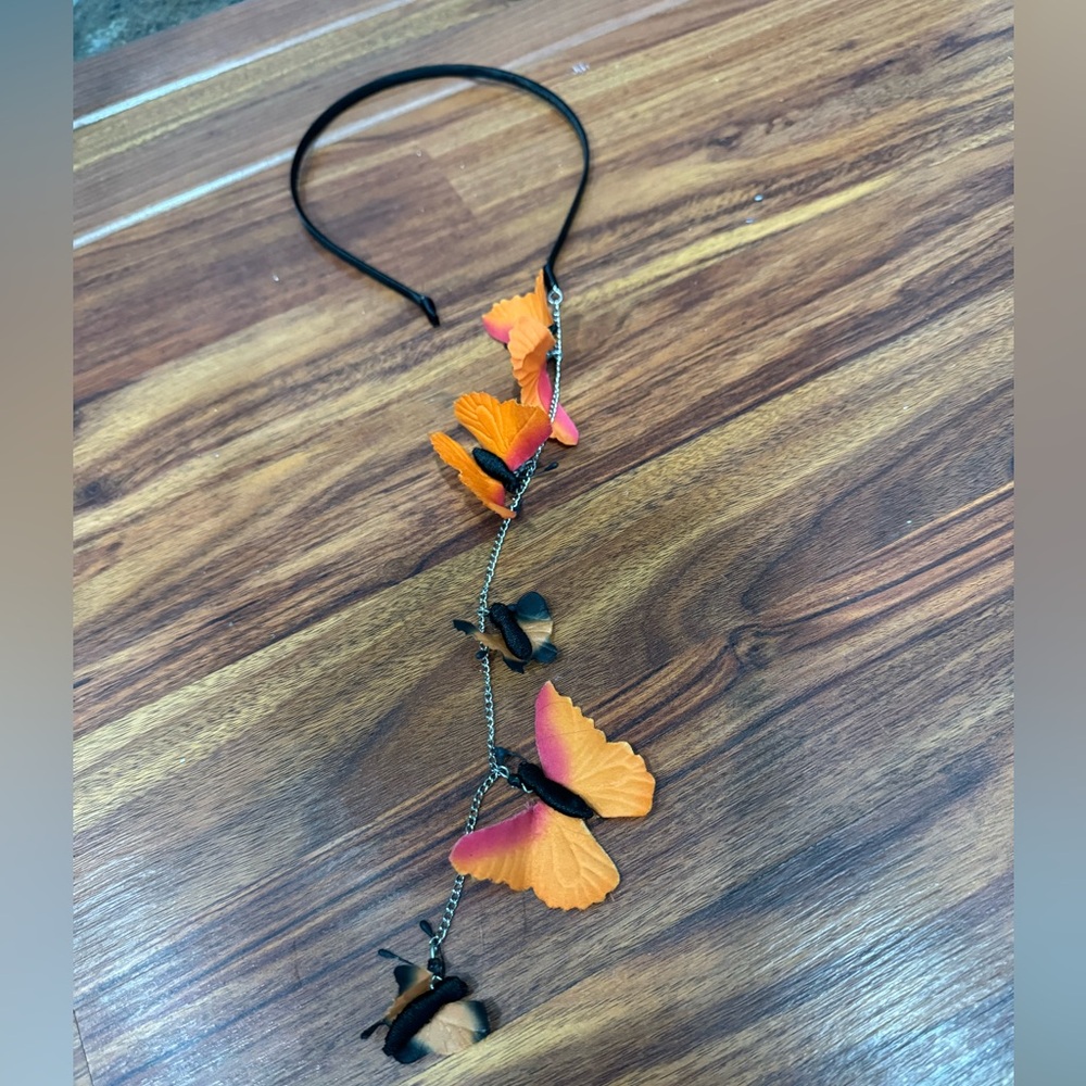 Black head band with butterfly extension